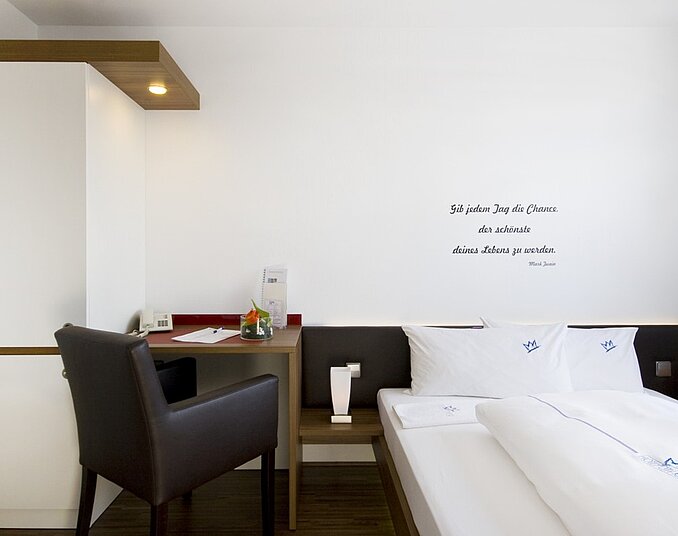 Bright and cozy double room with desk – comfortable hotelroom at Lake Constance.